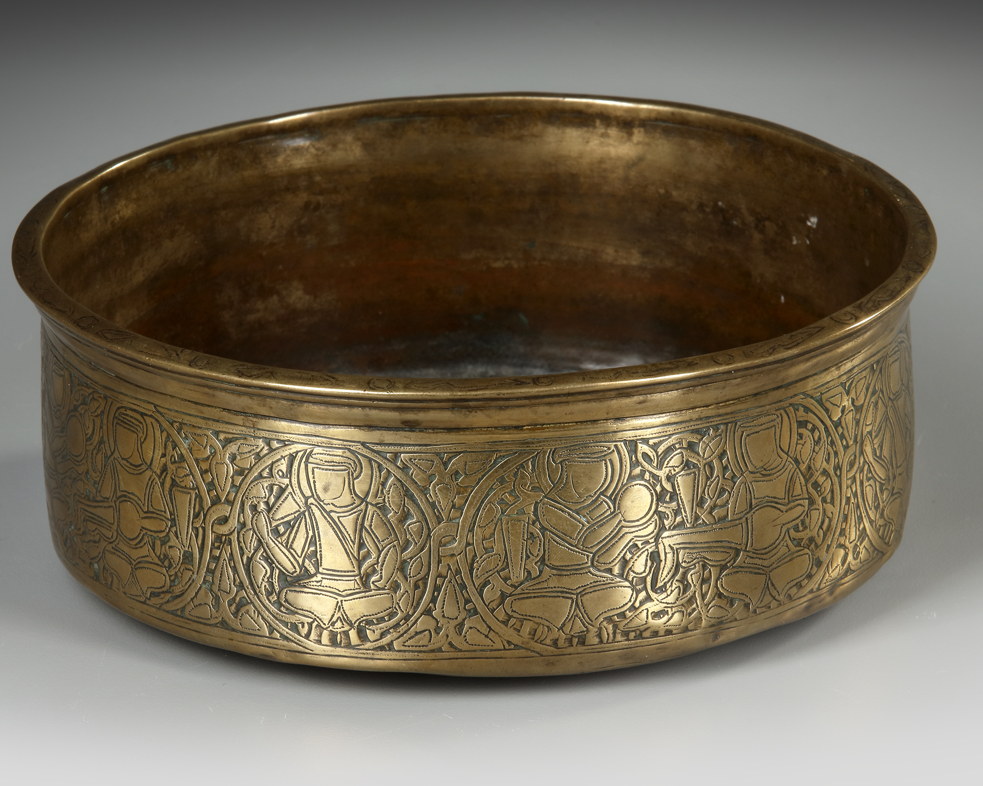 A FINE MAMLUK BRASS BOWL WITH A FLARED RIM EGYPT OR SYRIA 14TH CENTURY