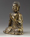A CHINESE  GILT BRONZE FIGURE OF A BUDDHA, LATE MING DYNASTY, 17TH CENTURY