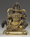 A Sino-Tibetan gilt bronze figure of Jambhala