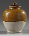 A CHINESE AMBER-GLAZED JAR AND COVER, TANG DYNASTY (618-907)