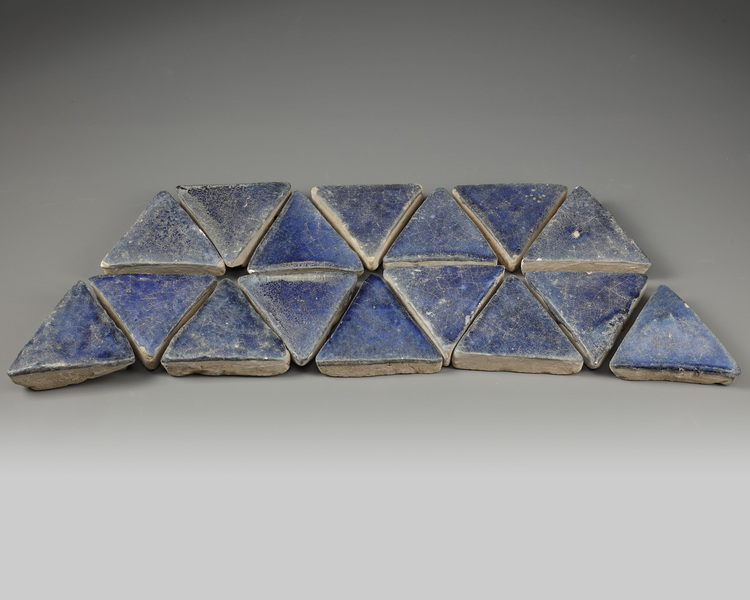 Sixteen Islamic blue glazed eath-ware tiles