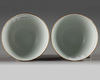 A pair of Chinese coral-red-decorated small cups