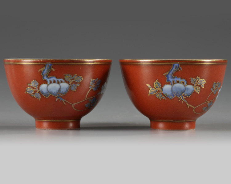 A pair of Chinese coral-red-decorated small cups
