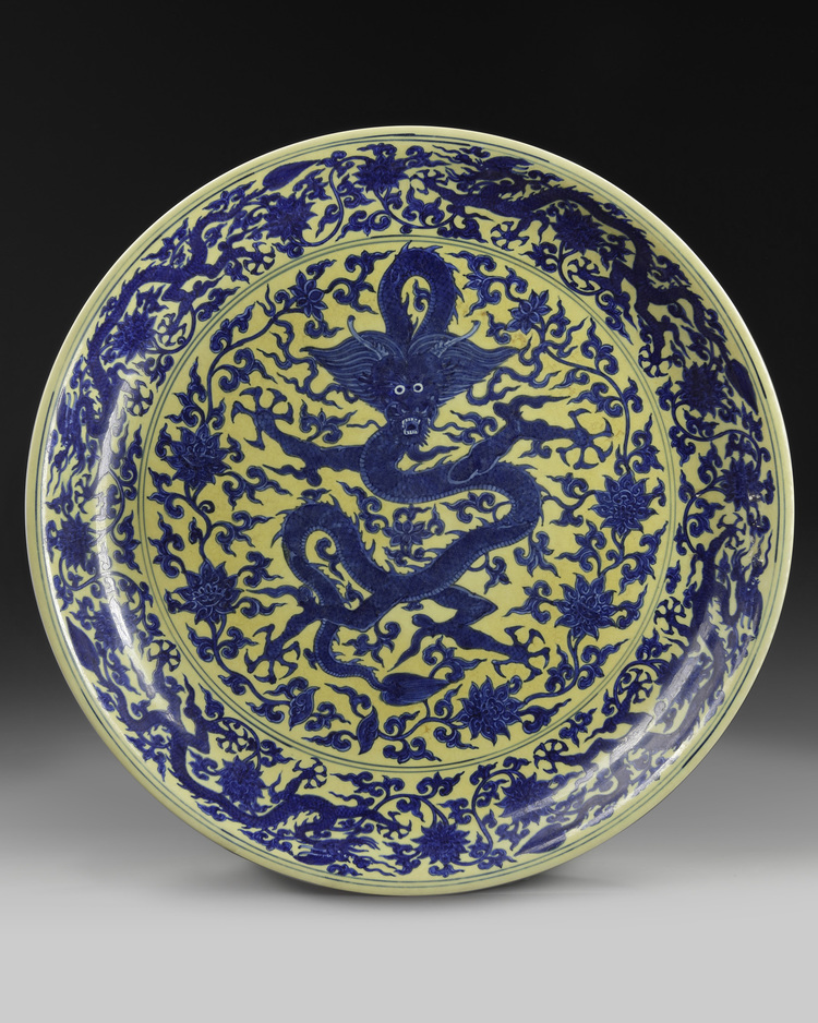 A massive Chinese yellow-glazed blue and white dragon charger