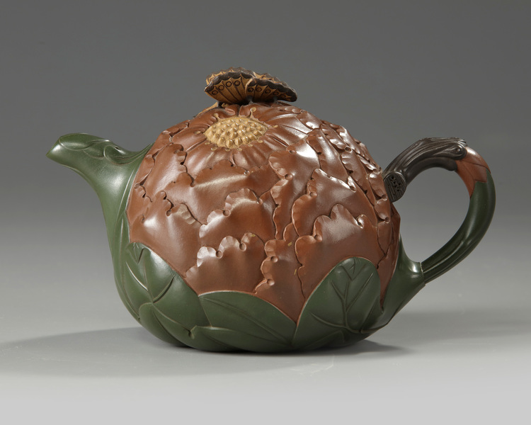 A Chinese Yixing green with brown-clay 'lotus & butterfly' teapot