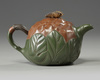 A Chinese Yixing green with brown-clay 'lotus & butterfly' teapot