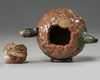 A Chinese Yixing green with brown-clay 'lotus & butterfly' teapot