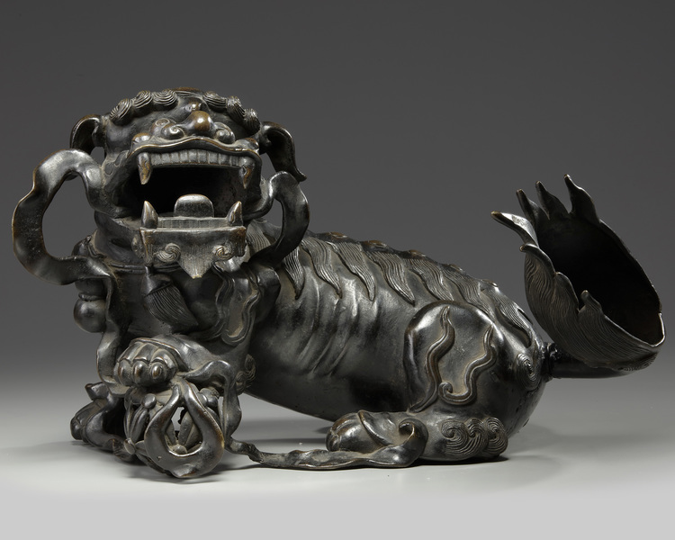 A CHINESE BRONZE BUDDHIST LION, CHINA, 19TH CENTURY