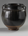 A Chinese brown-glazed ribbed jar