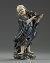 A Chinese enamelled porcelain figure of Liu Hai