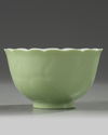 A Chinese pale-green glazed moulded 'floral' bowl