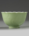 A Chinese pale-green glazed moulded 'floral' bowl