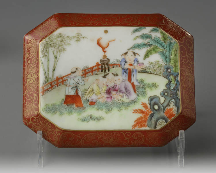 A Chinese coral-ground famille rose octagonal seal paste box and cover