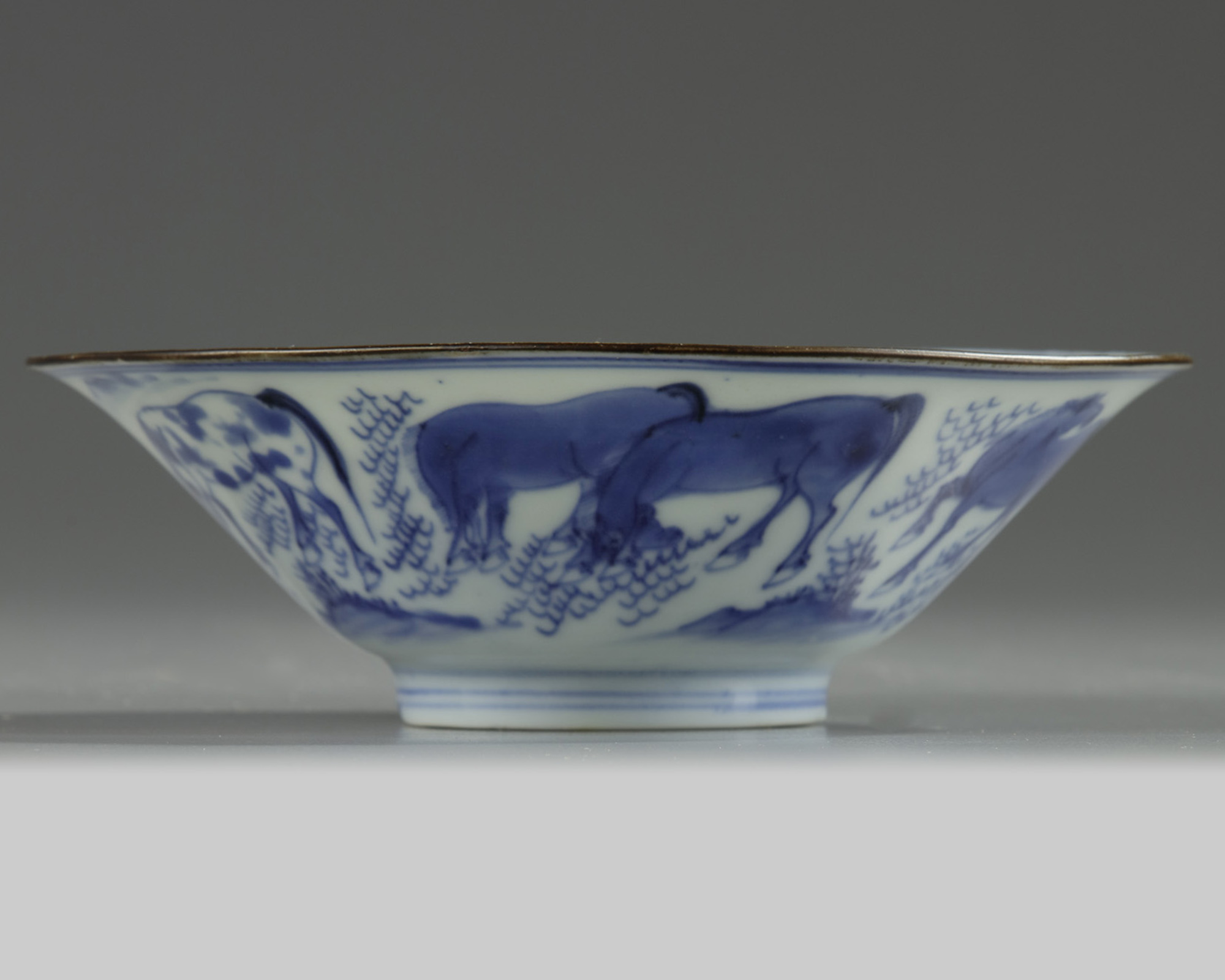 A Chinese blue and white 'Eight Horses of Mu Wang' conical bowl