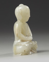 A Chinese white jade Shakyamuni