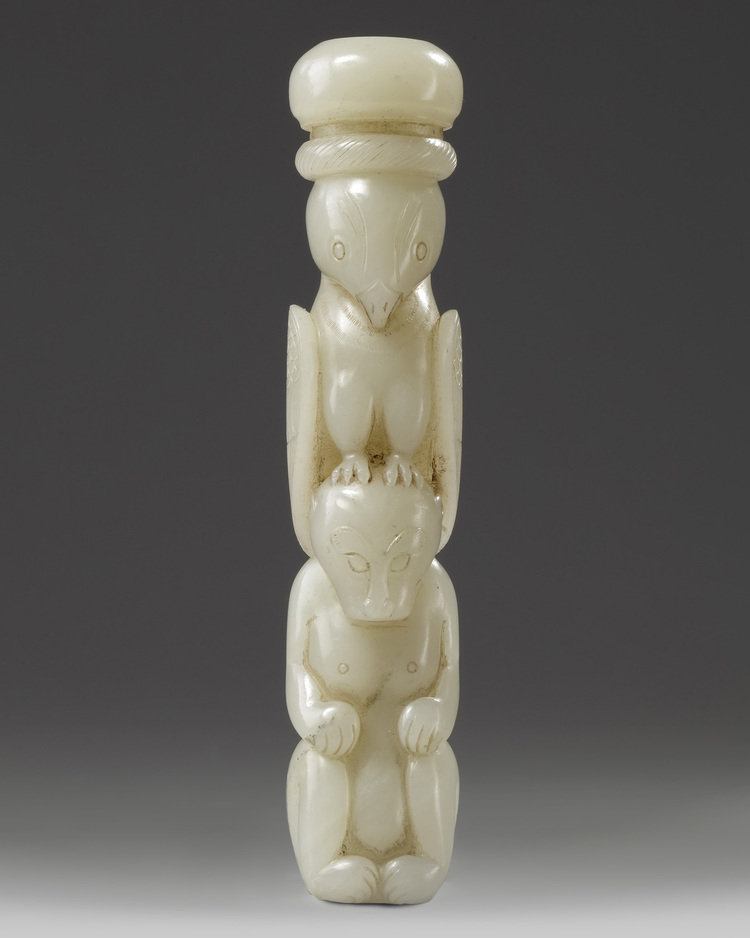 A Chinese pale celadon jade ying xiong knife hilt