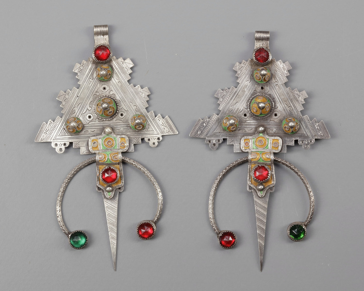 A pair of  mineral inlay fibula's
