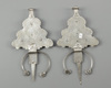 A pair of silver fibula with mineral stone inlay