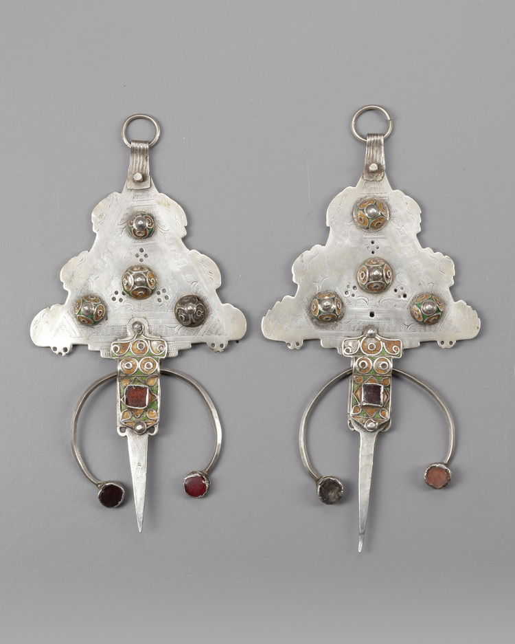 A pair of silver fibula with mineral stone inlay