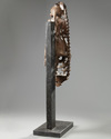 An Indian wood sculpture of a lady on a marble stand