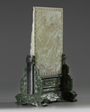 A CHINESE PALE CELADON JADE TABLE SCREEN ON A SPINACH JADE STAND
