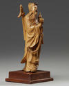 A Chinese root wood carving of an Immortal
