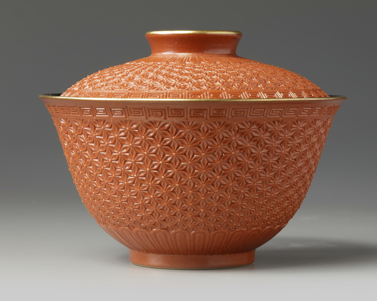 A Chinese imitation-cinnabar lacquer bowl and cover