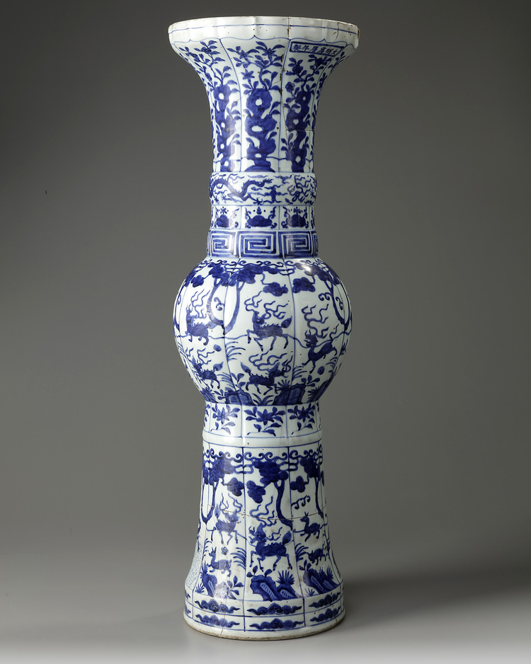 A large Chinese Ming-style blue and white 'mythical beasts' gu vase