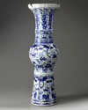 A large Chinese Ming-style blue and white 'mythical beasts' gu vase