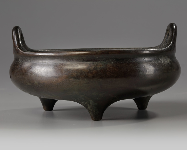A Chinese bronze tripod censer