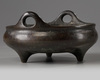 A Chinese bronze tripod censer