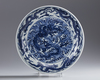 A large Chinese Ming-style blue and white 'dragon' charger