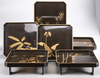 A original set of six lacquered trays in their original box