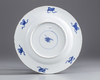 AN ENAMELLED CHINESE BLUE AND WHITE DISH, 18TH CENTURY