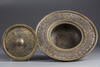 An Islamic silver inlaid brass hand wash bowl