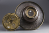 An Islamic silver inlaid brass hand wash bowl