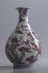 A Chinese blue and white and underglaze copper red 'dragon' pear-shaped vase, yuhuchunping