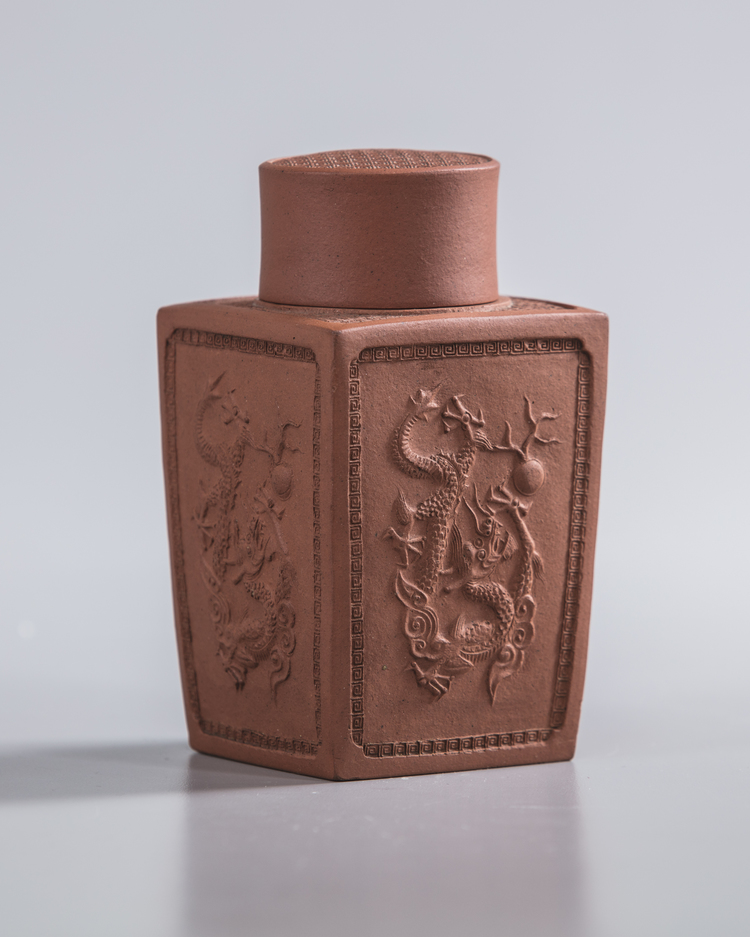 A Chinese yixing 'dragon' square-section tea caddy and cover