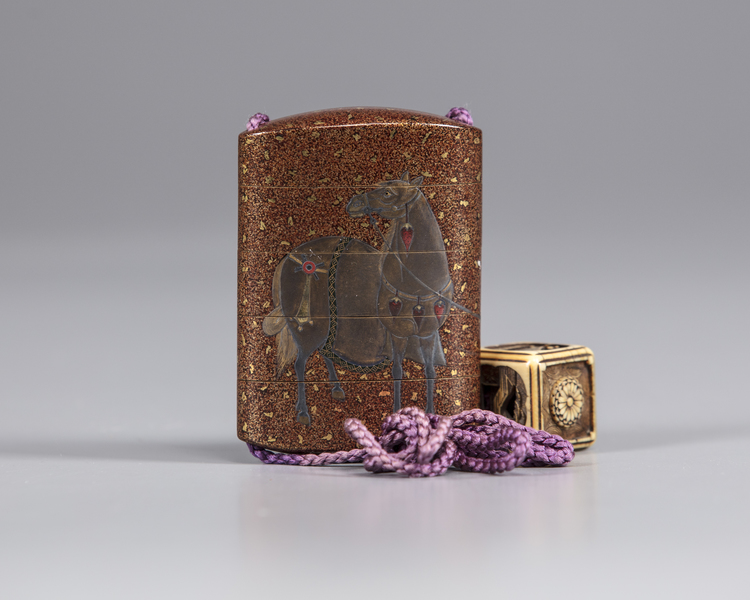 A Japanese Inro with a cubical shaped netsuke