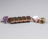 A Japanese Inro with a cubical shaped netsuke