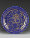 A large Chinese gilt-decorated powder blue-ground 'dragon' charger