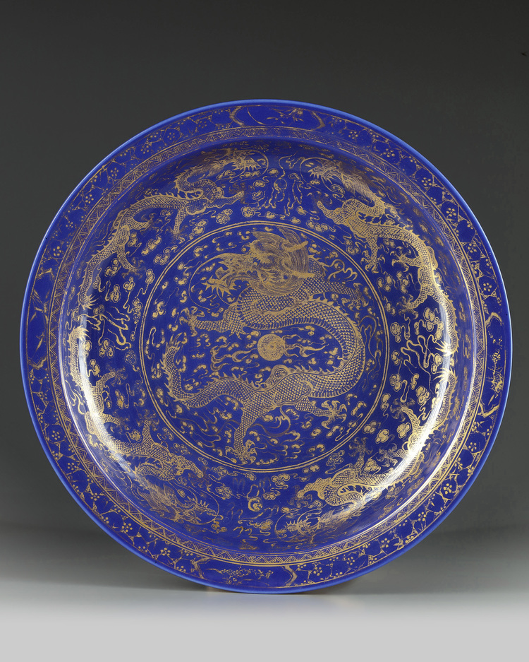 A large Chinese gilt-decorated powder blue-ground 'dragon' charger