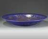 A large Chinese gilt-decorated powder blue-ground 'dragon' charger