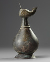 An Islamic bronze oil lamp