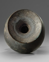 An Islamic bronze oil lamp