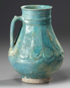 A KASHAN TURQUOISE GLAZED JUG, PERSIA, 13TH CENTURY