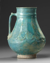 A KASHAN TURQUOISE GLAZED JUG, PERSIA, 13TH CENTURY