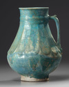 A KASHAN TURQUOISE GLAZED JUG, PERSIA, 13TH CENTURY