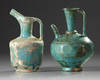 Two Islamic turquoise glazed jugs