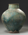 A large Islamic Seljuq turquoise glazed baluster vase